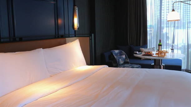 istock Cozy modern bedroom in luxury hotel with comfortable king-size bed, 2164135533