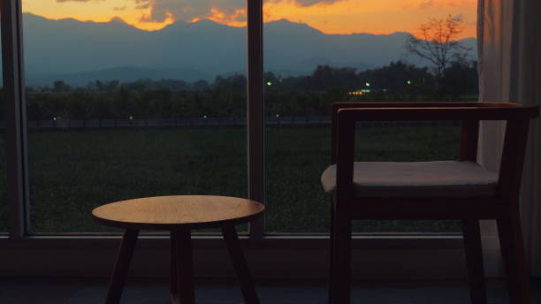 istock Serene sunset view from minimalist living room interior with mountains 2164135998