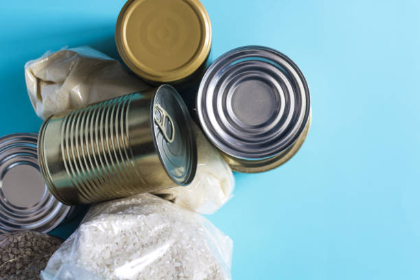 istock Long-term storage products close-up on a light background, various cereals canned products 2164137299
