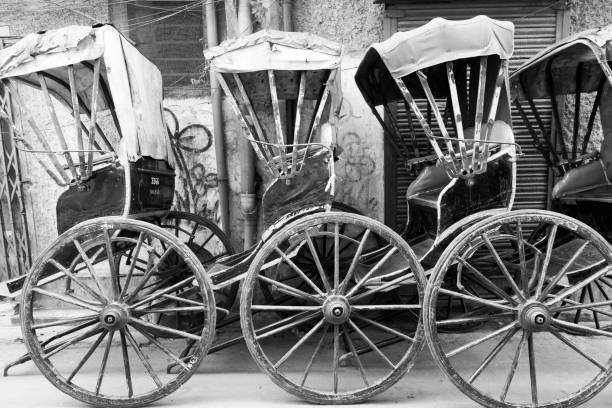 istock India, West Bengal, Kolkata, College Square. Rickshaws in a line. In B&W. 2164139432