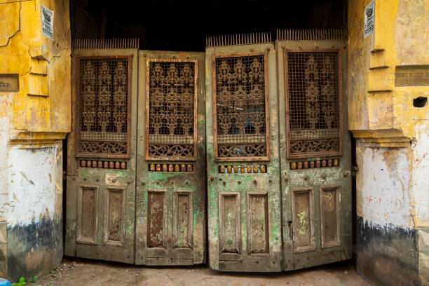 India, West Bengal, Kolkata, Bow Bazaar. Carved wooden gate.