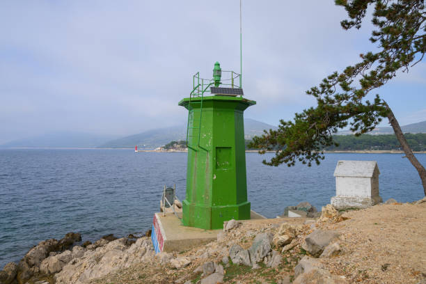 Cres, Croatia - November 1, 2022: An old lighthouse near the city cres on a sunny day