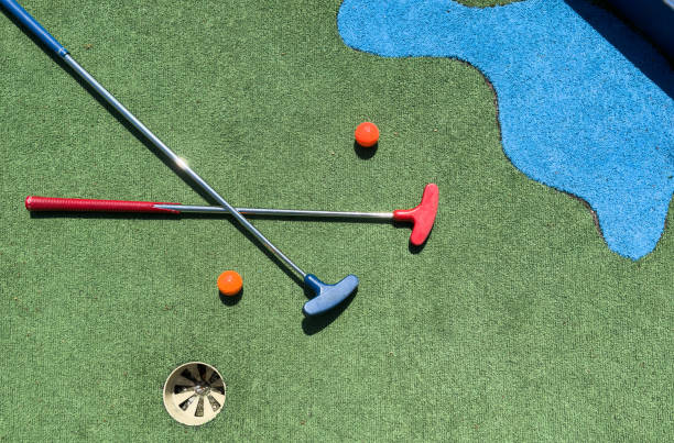 istock Golf stick and ball on green grass close up. 2164142134