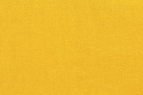 istock Yellow gold cotton fabric cloth texture for background, natural textile pattern. 2164144128
