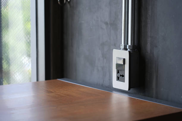 istock The power socket is mounted on the wall. Beside the work desk in the room. 2164144725
