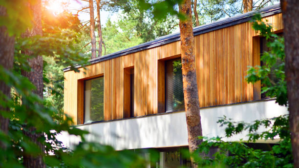 istock Upscale house in wooded area. 2164145239