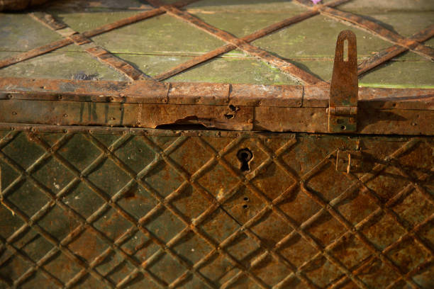 An ancient iron-bound wooden chest with a broken keyhole.