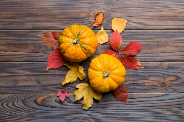 istock Autumn composition. Pattern made of dried leaves and other design accessories on table. Flat lay, top view 2164147337