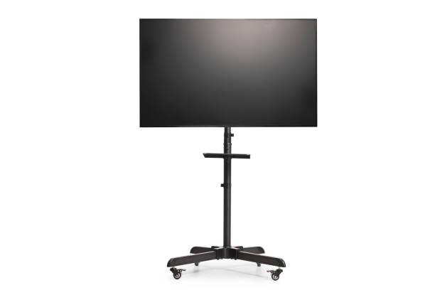 istock Black metal tv stand on wheels with a flat tv screen 2164148997