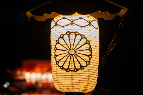 Traditional Japanese festival lanterns often appear at festivals, with chrysanthemum designs on them.