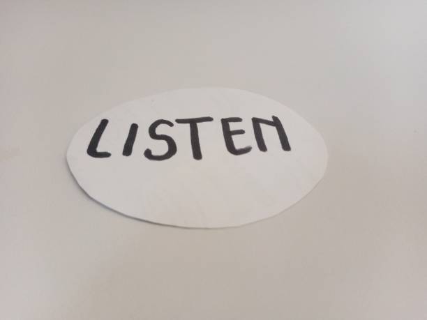 istock notebook with the inscription listen. 2164158261
