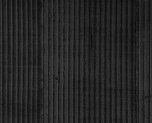 artistic of dark black old and rusty zinc metal sheet wall. industrial backdrop for design. artistic of dark black old and rusty zinc metal sheet wall. industrial backdrop for design. vintage style metal sheet wall texture. corrugated metal fence ideas stock pictures, royalty-free photos & images