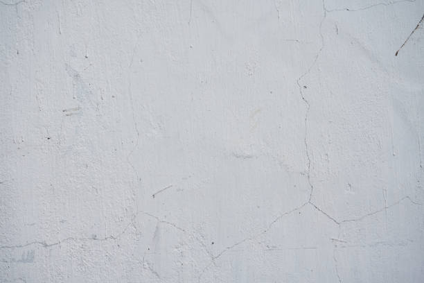 Dirty surface, Concrete wall with cracks, gray color background, cement rough surface texture. Renovation of old residential premises and apartments. old plaster stucco texture