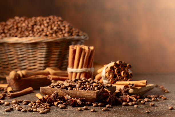 istock Coffee beans with spices on a brown vintage background. 2164160836