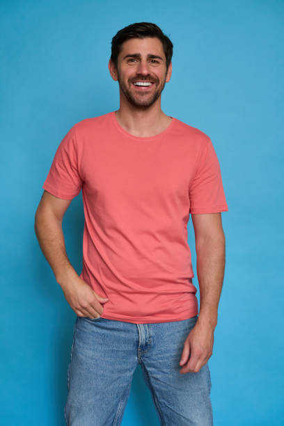 istock Handsome man smiling and posing on blue background 2164162037