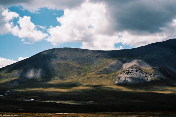 Shadows of clouds on mountain peaks