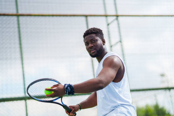 istock The tennis player is getting ready to serve the ball. 2164165421