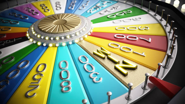 Colorful Game Wheel Spinning With Various Prize Amounts In A Studio Setting