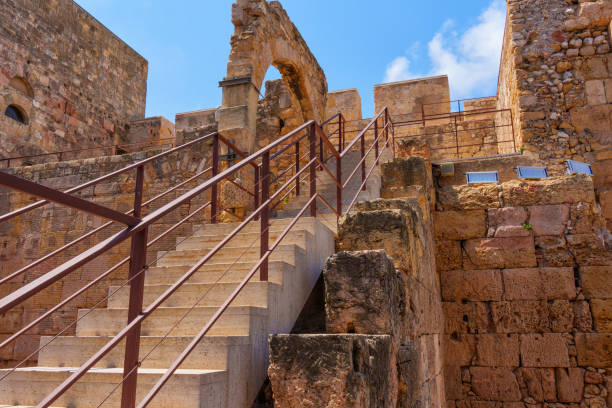View up the stairs towards an archway in ancient Tarragona site.