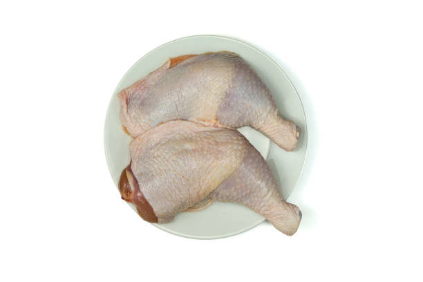 Chicken Thighs can be a healthy addition to diet as long as preparing, don't use much added oil, like grilling, baking or stir-frying. Also be mindful of the sodium add during cooking. Fresh Chicken Thighs bone-in in a white plate isolated on white background with clipping path top view flat lay. dont eat meat stock pictures, royalty-free photos & images