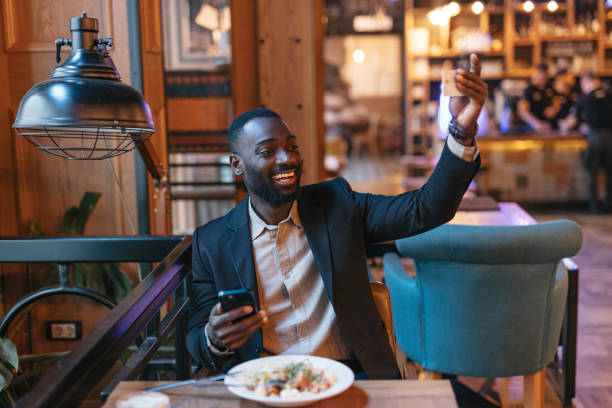 istock Man signaling waiter for bill at restaurant. 2164166551
