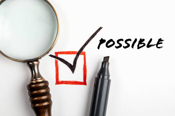 POSSIBLE Concept. Text and check mark, magnifying glass on white background.