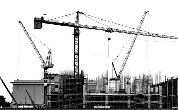 istock Building Construction with cranes are working in the construction site, Construction for background. Black and white. 2164170818