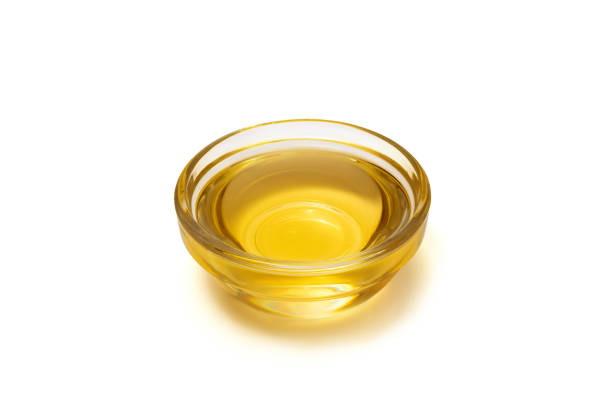 Vegetable oil in glass bowl isolated on white