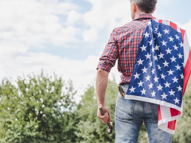 istock American Flag, attractive man in work clothes 2164175056