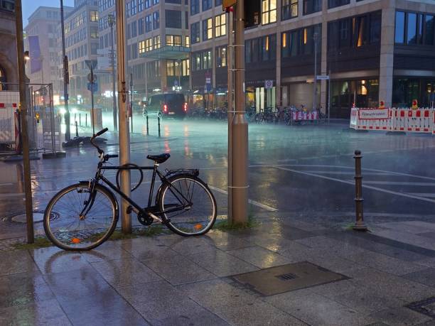 istock Rainy evening and the bycicle left on the street 2164175561
