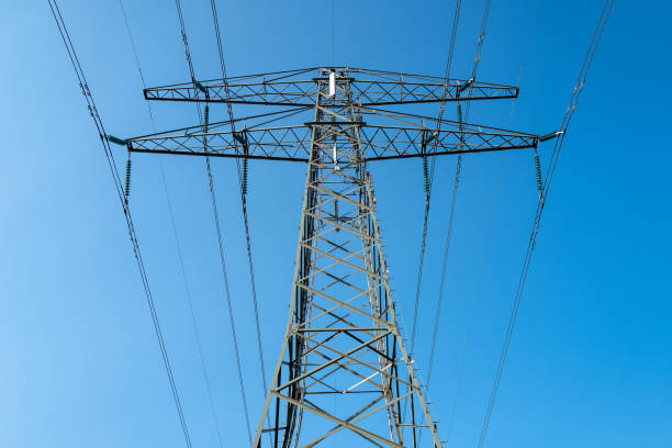 View on one outdoor high voltage electric transmission line support metal construction tower pillon
