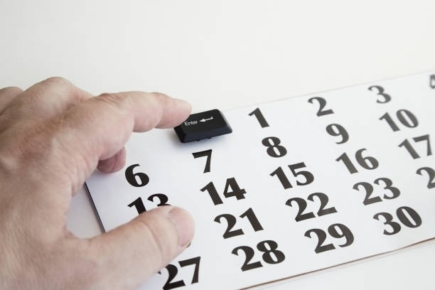 istock A hand presses the Enter key from a computer keyboard on a calendar instead of the first day of the month, beginning of the month, start of a project, start of studies, mission start 2164179620