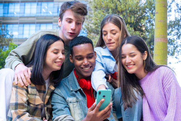 istock Students having fun with mobile phones creating content on social media. 2164180997
