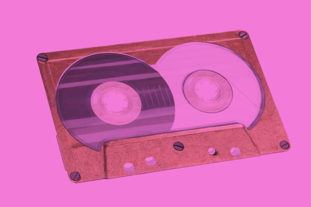 istock Retro audio cassette tape on ultraviolet background 2164182915