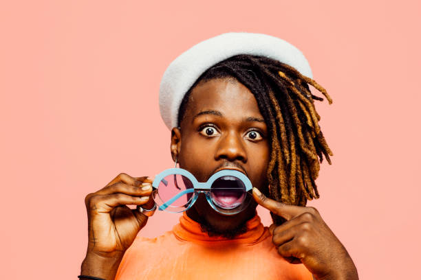 istock Fun portrait of a young guy with cool sunglasses 2164185456