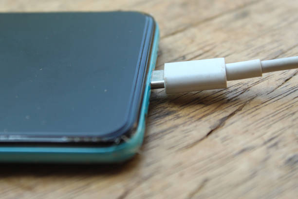close up of charging cable on smartphone. smartphone in charge
