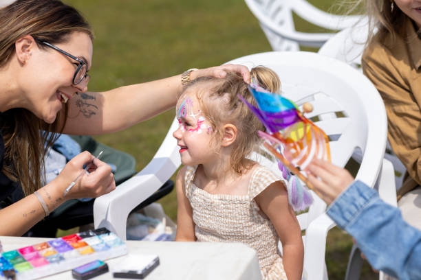Face painting on a young happy girl.