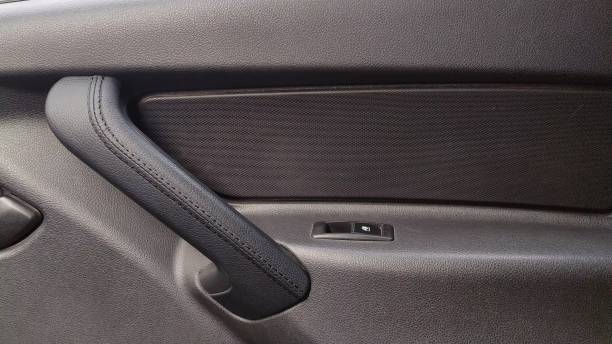 istock Car door inside with a door handle and door window regulator. Car interior 2164186933