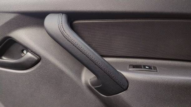 istock Car door inside with a door handle and door window regulator. Car interior 2164186940