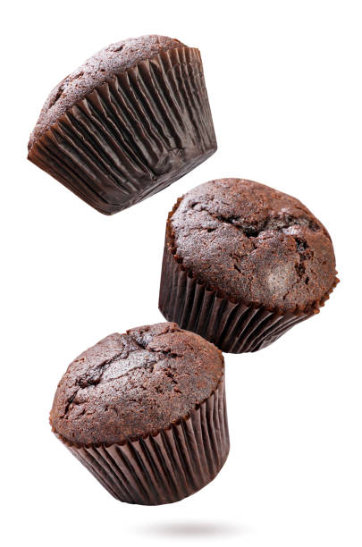 istock Chocolate muffins falling on white background. Isolated 2164187069