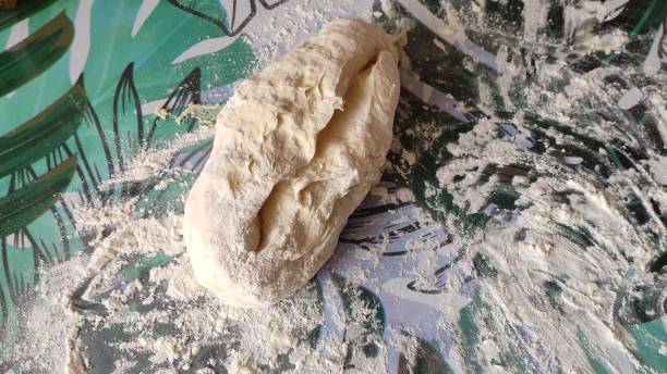 istock Raw kneaded dough lies on the table 2164187503