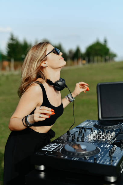 istock Female DJ Feeling Elation While Crating An Awesome Mountain Party 2164188117