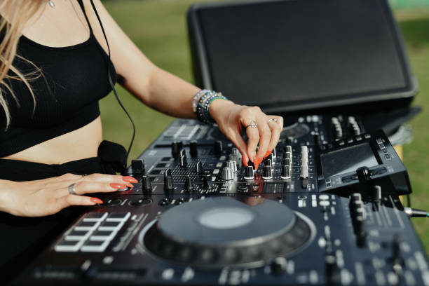 istock Expert Female DJ Adding Special Effects To Song On Turntable 2164188146