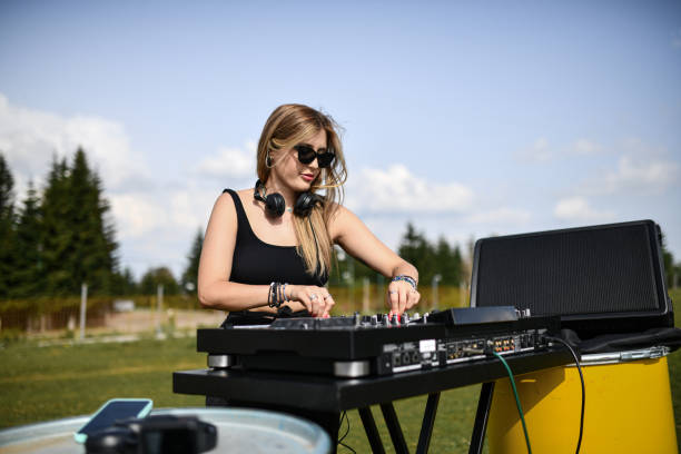 istock Blond Female DJ Working The Turntable With Efficiency 2164188395
