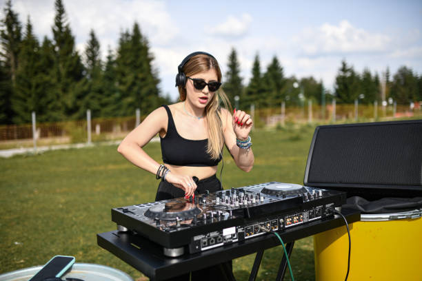 Excited Female DJ Lighting Up With Mountain With Her Turntable