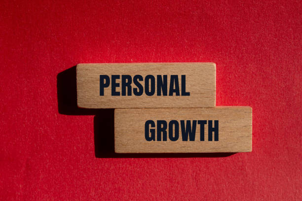 istock Personal growth message written on wooden blocks with red background 2164189129