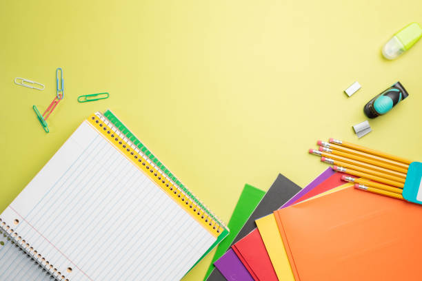 istock Back to school background with student supplies on bright colorful background. 2164191749