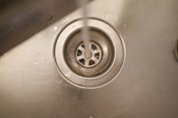 istock water pouring from a faucet tap slow motion 2164193422