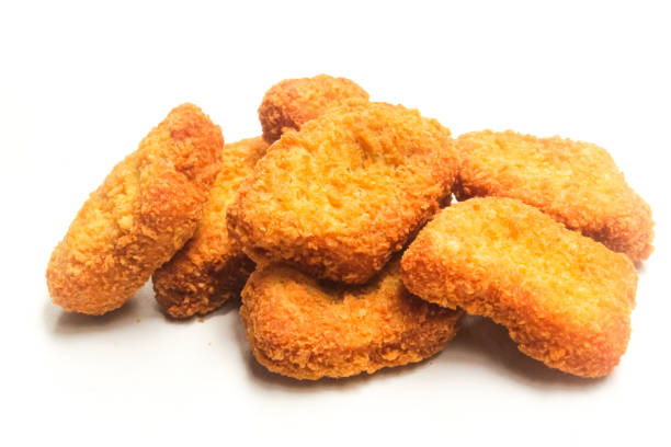 istock chicken nuggets isolated on white background 2164193932