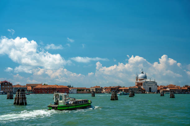 Venice, Italy - June 05, 2024: View to Giudecca. Il Redentore on the background.